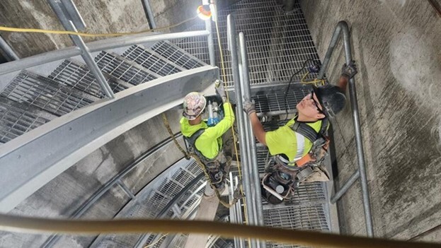 Workers finish building the stairway at the Fremont shaft site.