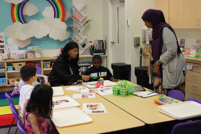 SPP educators with students n a classroom.