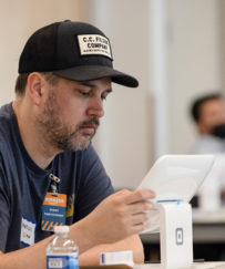 male business owner using new square sales system