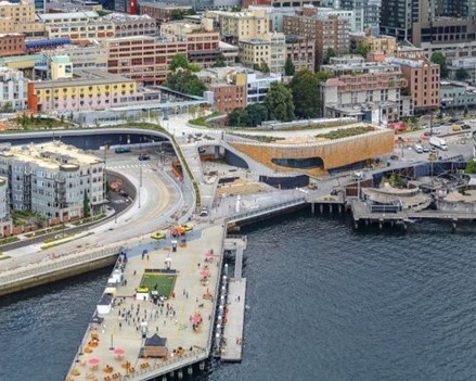 view of the waterfront from the bay, showing the overlook walk and ocean pavilion