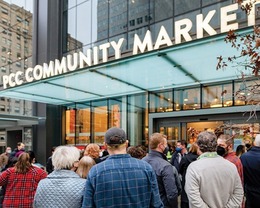a crowd of people in front of the PCC Downtown store