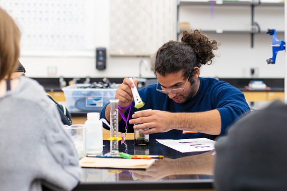 An incoming Seattle Promise scholar participates in a science lab activity for 2024 Summer Bridge 