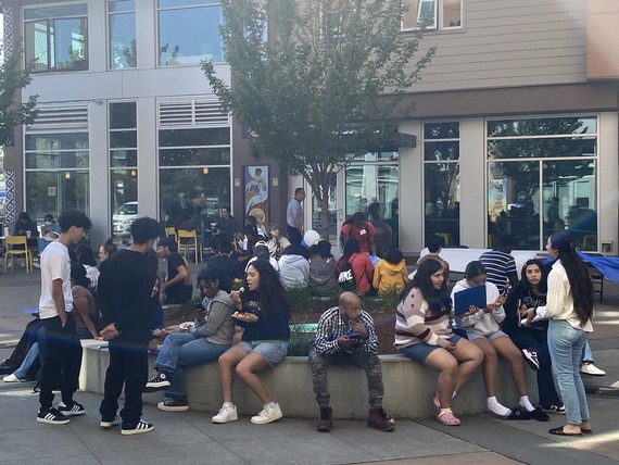 Youth attendees gather in the Plaza Jose Marti at El Centro de la Raza in Beacon Hill