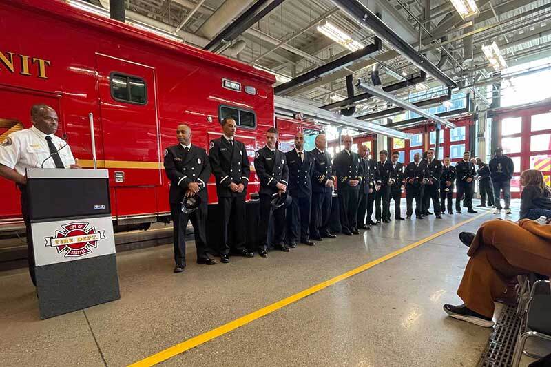 Seattle fire personnel at a promotional ceremony in Fire Station 10
