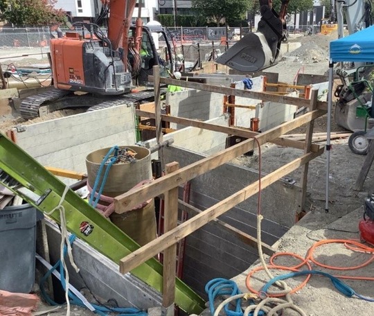 Workers prepare to pressure test a pipe at the Fremont shaft site.