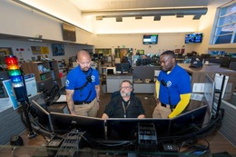 CARE community crisis responders and 9-1-1 dispatcher viewing monitors in 9-1-1 Center