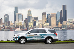CARE responder vehicle with City of Seattle cityscape in background