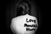 T-shirt with the words "Love Shouldn't Hurt" by Sydney Sims on unsplash.com about safety