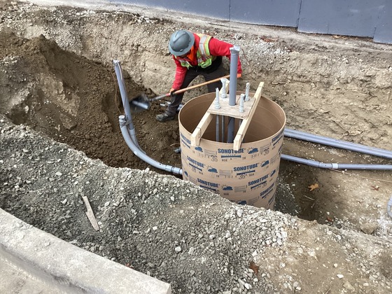 Photo showing crews working on installing underground conduits along west side of Rainier Ave S at S College St.