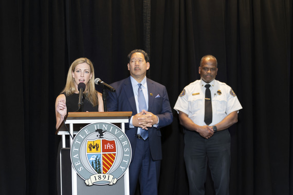 CARE Chief Barden, Mayor Harrell and SFD Chief Scoggins standing behind a podium