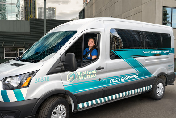 CARE community crisis responder sitting in a CARE responder ADA sprint van
