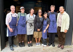 Donna Moodie stands among a group of Marjorie employees and Mayor Harrell