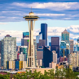 The Space Needle against a backdrop of Downtown Seattle buildings