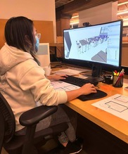 SYEP Learn and Earn student studying software development sits in front of a computer screen