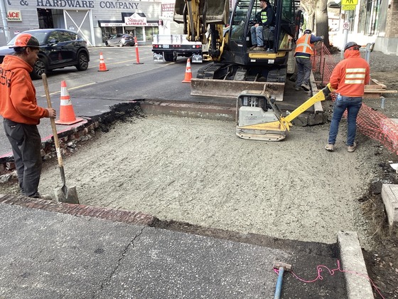 Crews backfilling the east side of Rainier Ave S and S Grand St.