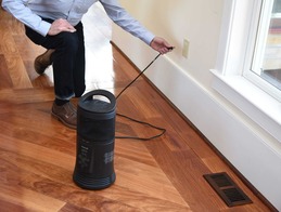 picture of person plugging space heater directly into wall outlet