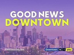 Good News Downtown with website over Seattle skyline