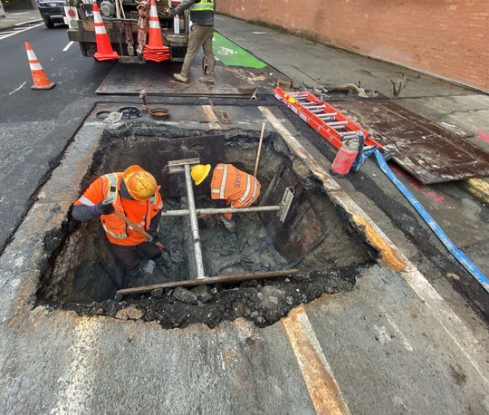Seattle Public Utilities crews working on water mains. 