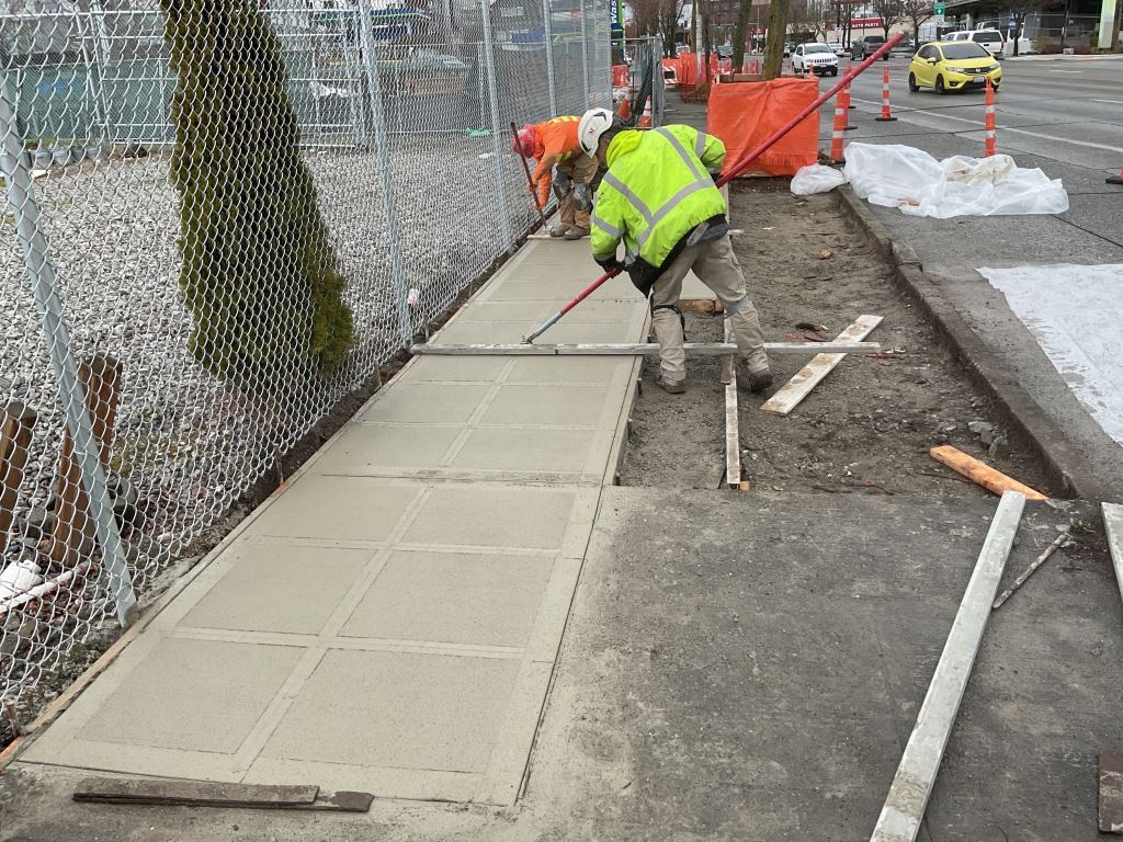 Crews restore the sidewalk on the west side of 15th Ave NW between NW 50th St and NW 51st St. 
