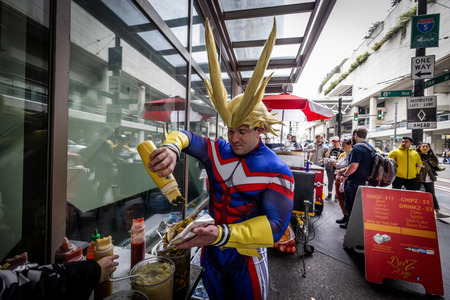 A person grabs a hot dog as a manga character at Emerald City Comic Con