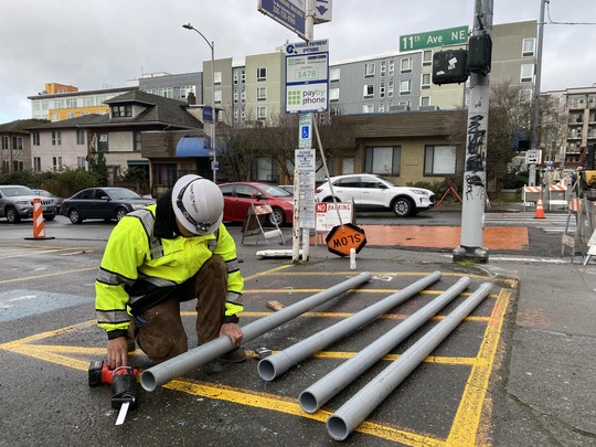 Crews preparing electrical conduit.    