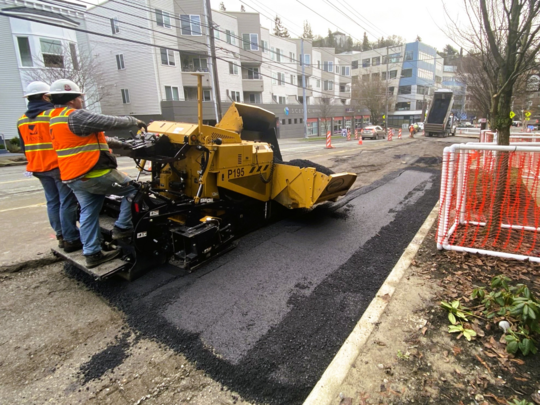 Crews patch the road with asphalt after completing stormwater construction. 