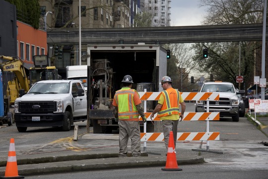 Construction Crews Working on the Denny Way Paving Project