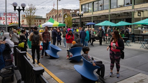 People enjoying the new First and Pike public space