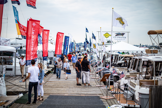 Visitors tour boats at the Boats Afloat Show.  
