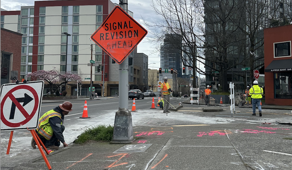 Image showing construction workers, orange cones, signal revision ahead and turn right signs
