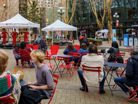 People watching a performance in Pioneer Square