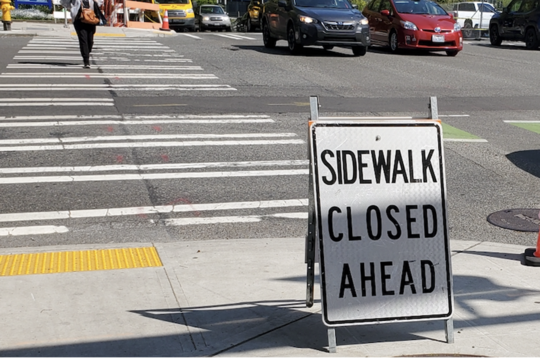 Map showing 'Sidewalk Closed' sign and crosswalk on Denny Way