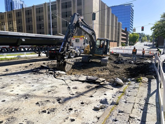 Pavement demolition on NE 43rd St at 11th Ave NE.