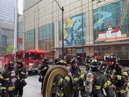 Firefighters on scene for a fire in a commercial building.