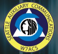 Seattle auxiliary communications service logo of Chief Seattle profile in a triangle within a circle with the radio sign W7ACS.