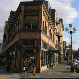 sidewalk with vintage street light and historic buildings