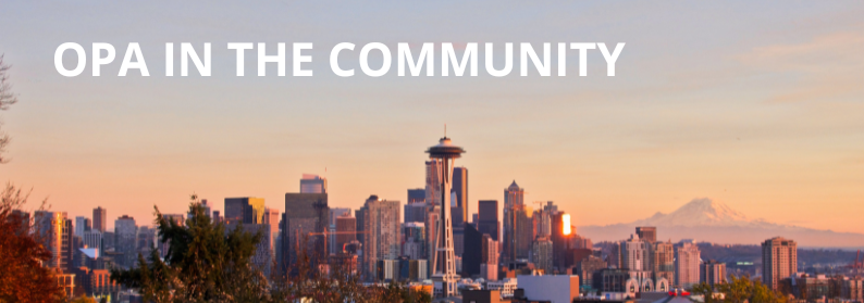Seattle skyline at sunset, with Mt. Rainier in the background. Text says OPA in the community.
