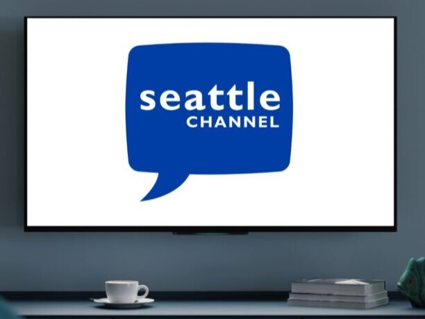 graphic of the seattle channel on a tv over a tv stand