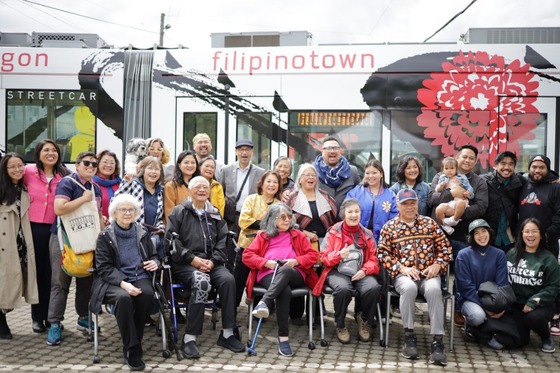 Community members in front of the new Filipinotown streetcar