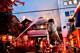 Firefighters battle a fire in a vacant building in the University District