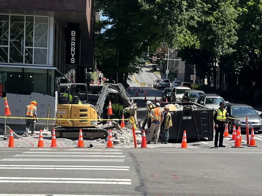 Image showing construction crews working on the sidewalk at Denny Way and Westlake Ave N