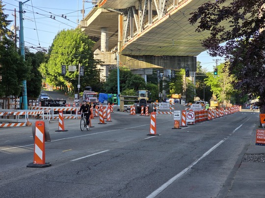 Signs direct traffic around the construction area on Eastlake Ave E. 