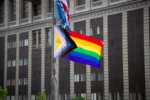Pride flag being raised at Seattle City Hall