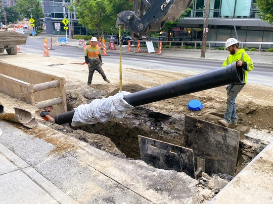 Crews place a new water main on Eastlake Ave E. 