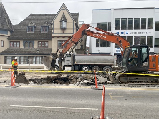 Crews demolish the road on Eastlake Ave E to prepare for new concrete.