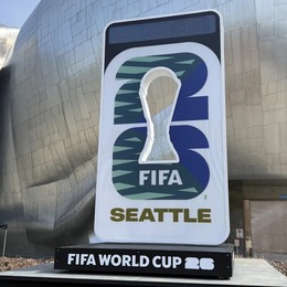 Sign with FIFA Seattle logo in front of silver building
