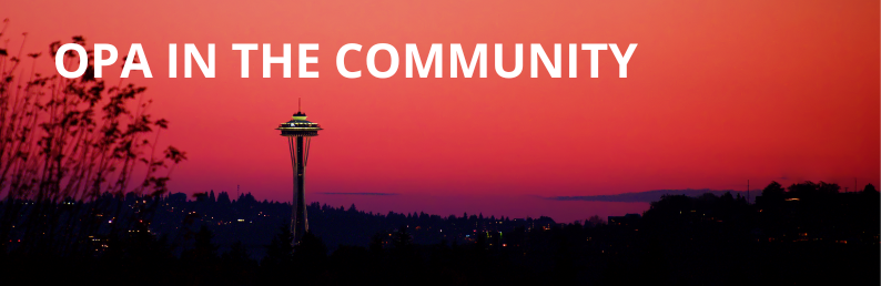 Seattle Skyline at sunset with the words 'OPA in the Community' written in white text at the top