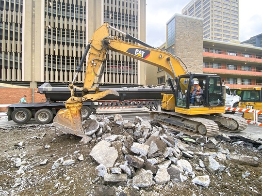 Crews demolish old concrete in the University District. 