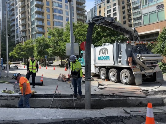 Image showing construction crews and vehicles working on Denny Way