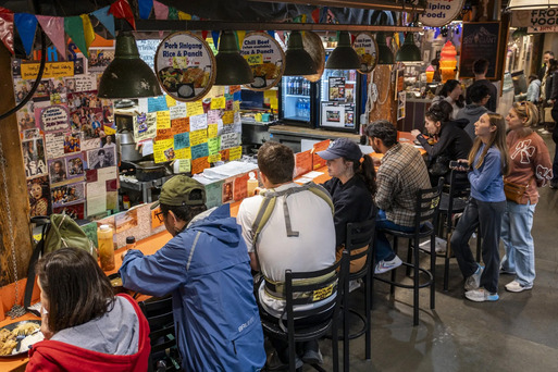 People eating and drinking at a bar